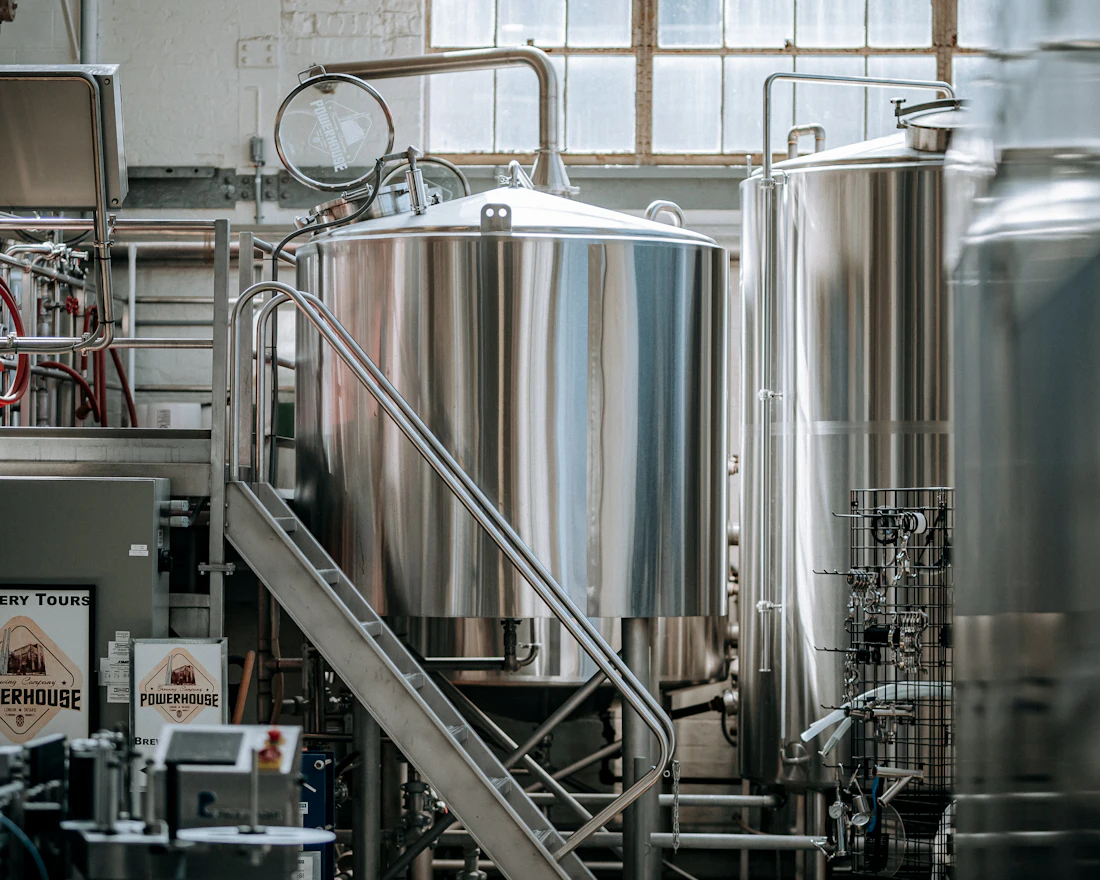 Stainless steel brewing tanks inside the brewery
