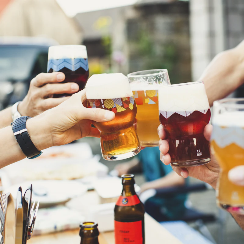 Friends raising glasses of beer